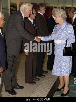 OVERSEA USE ONLY: Britains Queen Elizabeth II greets veteran British Everest climber George Band and colleagues Sherpa Nawang Gombu from Nepal (Left), *..Briton Mike Westmacott (3rd Right) and New Zealander George Lowe (4th Right) at the Odeon cinema in London's Leicester Square. An evening of celebrations was held to mark the first ascent of Mount Everest by Sir Edmund Hillary and Sherpa Tenzing Norgay in 1953. Stock Photo