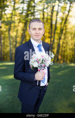 Stylish groom in suit Stock Photo