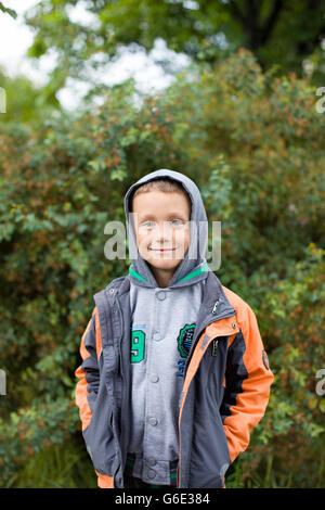 The boy looks at the camera Stock Photo