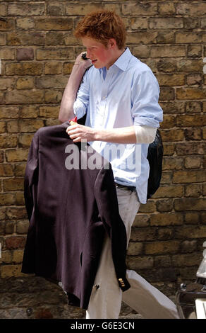 Prince Harry, the younger son of the Prince of Wales, carries his belongings to a car as he leaves Eton College on his last day at the top public school where he has been a pupil for five years. * Like his older brother William, Harry has spent his Eton schooldays boarding at Manor House, on the site of the lodgings of probably the most famous Old Etonian of them all, victor of Waterloo, the Duke of Wellington. It has been announced that Prince Harry is to apply for entry to the Royal Military Acdemy at Sandhurst. Stock Photo