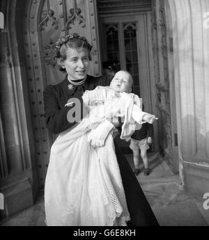 HILARY JAMES, baby son of the Hon. Anthony Wedgwood Benn, in the arms of his mother after the christening in the Crypt Chapel of the House of Commons, London. The Hon. Anthony is Labour Member of Parliament for the South-east Division of Bristol. Stock Photo