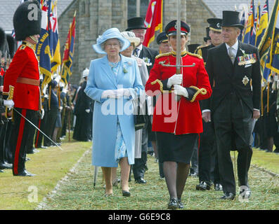 Britain's Queen Elizabeth II with the Duke of Edinburgh, walks behind the Sword of State as she presides over the Tynwald ceremony during a day long visit to the Isle of Man. * The Manx Parliament - the oldest continuous parliament in the world - established more than 1,000 years ago by Viking settlers, held its annual open-air sitting in the picturesque village of St John's, in the west of the island. The Queen, who holds the title of Lord of Mann, attended the Tynwald ceremony, as thousands gathered to celebrate the island's national day. Stock Photo