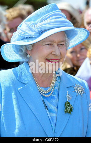 Britain's Queen Elizabeth II holds her handbag as she presides over the  Tynwald ceremony on the Isle of Man Stock Photo - Alamy