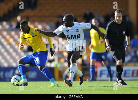 Coventry City's Franck Moussa (left) holds off Port Vale's Anthony Griffith (right) during the Sky Bet League One match at Vale Park, Stoke. Stock Photo