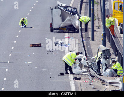 Police start the clear-up operation at the scene on the M56 south of Manchester where a four-vehicle pile-up, left seven people dead and two others fighting for their lives. * The accident, which involved a minibus and three other vehicles, happened close to junction 4 near Wythenshawe. All of those killed and serious injured are believed to have been travelling in the minibus. Stock Photo