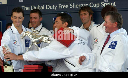 Winning Shergar Cup Team, Rest of The World (L-R) Doug Whyte, Fredrik Johansson, captain Frankie Dettori with Team Leader Pat Cash and Michael Roberts at Ascot. Stock Photo