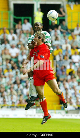 Dundee's Jim Patterson (front) with Didier Agathe (back) during the Celtic FC v Dundee United, Scottish Premier League game at Parkhead, Glasgow. Stock Photo