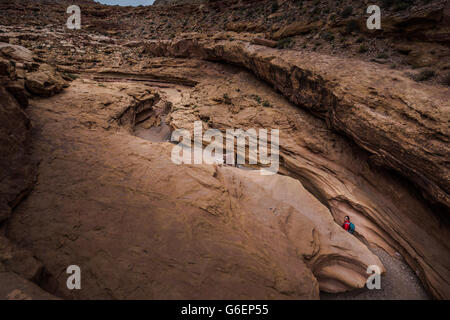 Backpacker exploring Little Wild Horse Canyon Utah view from above Stock Photo