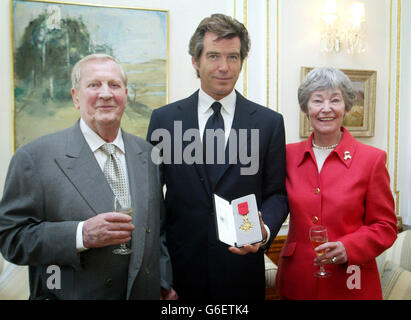 The Irish film actor and producer, Pierce Brosnan with his parents Mr and Mrs Carmichael, after he was awarded an honorary OBE (Officer of the Order of the British Empire) medal, in recognition of his outstanding contribution to drama and the British Film Industry. * by the British Ambassador, Stewart Eldon, at a ceremony in Dublin. Stock Photo