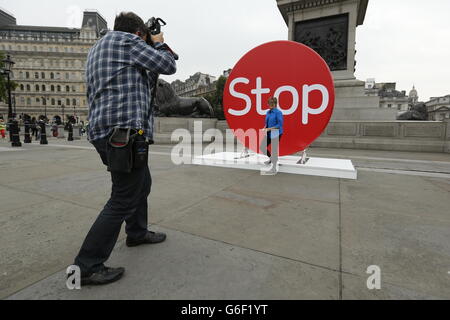 Chief Medical Officer, Professor Dame Sally Davies, stands before a three metre high disk in Trafalgar Square, London, to launch 'Stoptober', a campaign to get people to give up smoking. Stock Photo