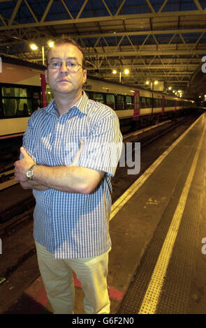 Commuter Ron Edwards, 43, a business development manager at Waterloo Station in central London. Mr Edwards was one of the rail commuters who suffered the journey from hell in sweltering temperatures when it took them an amazing nine hours to travel 70 miles. One hundred passengers, including a pregnant woman and elderly people, were left in baking carriages of a host of trains trying to get to London Waterloo after a series of accidents and delays. The initial hold-up on the line was because a 29-year-old rail worker died after slipping and falling on to a live line at Basingstoke station in Stock Photo