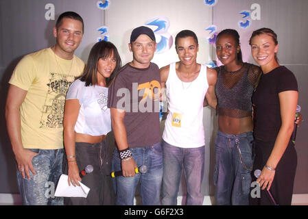 Damian Leach,23, Hertfordshire, (4th from left) poses with pop group Liberty X (from left) Tony Lundon, Michelle Heaton, Kevin Simm, Kelli Young and Jessica Taylor, during a photocall at Cargo in East London, after winning a competition to appear Liberty X's latest music video 'Jumpin'. Over the past month 3, the new video mobile network and Liberty X, launched a nationwide star search and after thousands of applications 10 lucky winners will star in their new video. Stock Photo