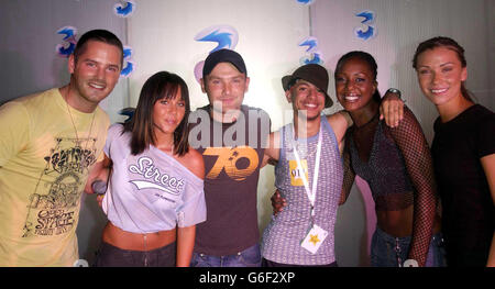 Nathan McDuffus, 18, Birminghan, (4th from left) poses with pop group Liberty X (from left) Tony Lundon, Michelle Heaton, Kevin Simm, Kelli Young and Jessica Taylor, during a photocall at Cargo in East London, after winning a competition to appear Liberty X's latest music video 'Jumpin'. Over the past month 3, the new video mobile network and Liberty X, launched a nationwide star search and after thousands of applications 10 lucky winners will star in their new video. Stock Photo