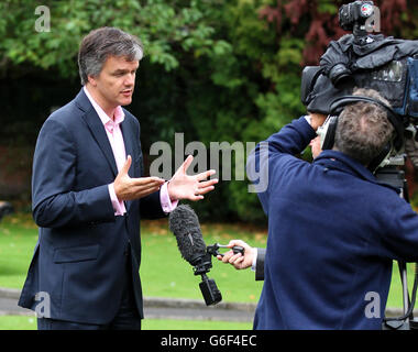 Liberal Democrat MP Michael Moore speaks to a TV crew close to his ...