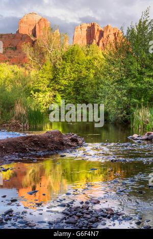 Cathedral Rock is reflected in Oak Creek in Red Rock Cross-Crescent Moon Park in Sedona, Arizona Stock Photo