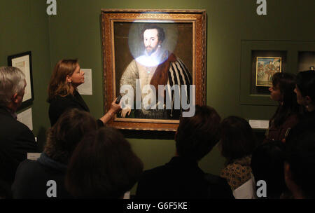 People are shown the painting 'Sir Walter Raleigh', Unknown English Artist 1588, part of the Elizabeth I and Her People exhibition at the National Portrait Gallery. Stock Photo