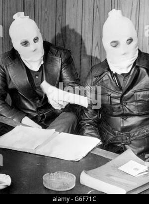 Hooded leaders of the Ulster Volunteer Force at a press conference in Belfast. Two members of the Ulster Defence Association were shot dead over the weekend by masked gunmen. Stock Photo