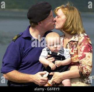 Chief Petty Officer, Paul Wain, greets his wife Sheena and 19-week-old son Murray, as HMS Splendid returns from the Gulf, to HM Naval base Clyde, Faslane. * The 107 crew were deployed to the Gulf region in early January and fired Tomahawk Cruise missiles against ground targets in Iraq during the conflict. Stock Photo