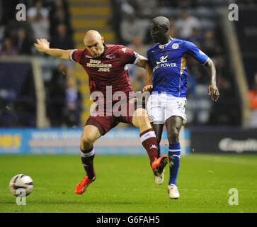 Leicester City's Zoumana Bakayogo (right) and Derby County's Conor Sammon (left) battle for the ball. Stock Photo