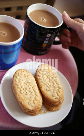 A Generic picture of Belvita Breakfast Biscuit with two mugs of Tea Stock Photo