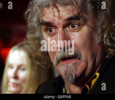 Comedian and actor Billy Connolly arriving with his wife Pamela Stephenson at the Warner Village cinema, Leicester Square, London, for the premiere of his new film 'The Man Who Sued God'. Stock Photo