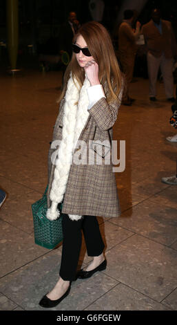 Nicola Roberts arrives at Terminal 5 at Heathrow Airport in London, after a weekend in Amsterdam with Girls Aloud band members Cheryl Cole and Kimberley Walsh. Stock Photo