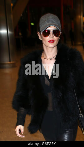 Cheryl Cole arrives at Terminal 5 at Heathrow Airport in London, after a weekend in Amsterdam with Girls Aloud band members Nicola Roberts and Kimberley Walsh. Stock Photo