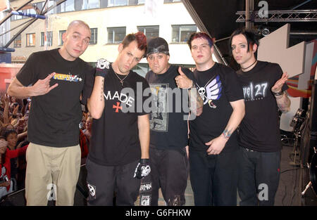 Rock group Good Charlotte (l-r) Chris Wilson, Joel Madden, Benji Madden, Paul Thomas, and Billy Martin pose for the media during the live recording of the British edition of MTV's TRL (Total Request Live) at MTV's Studios in Camden, north London. Stock Photo