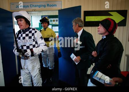 Horse Racing - Worcester Racecourse. Jockey A.P.McCoy (left) makes his way out past Denis O'Regan (right) for the Ladbrokes Maiden Hurdle at Worcester Racecourse, Worcester. Stock Photo