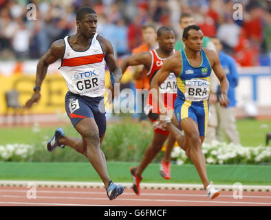 Dwain Chambers of Great Britain (left) powers home to give the GB 4x100 relay team victory in the Semi Final of the relay at the Athletics World Championships in Paris. Stock Photo