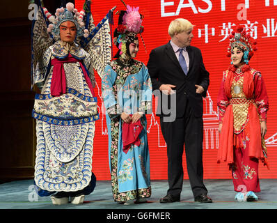 Mayor of London Boris Johnson meets members of the Peking Opera at the Reinwood Theatre in Beijing, where he saw a performance and had dinner with the cast. Stock Photo