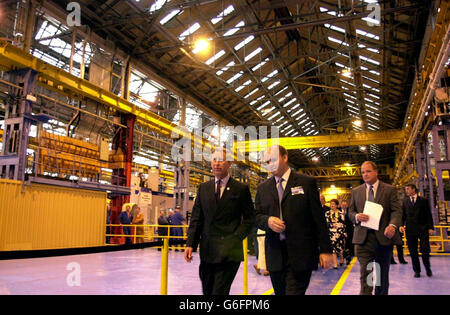 The Prince of Wales is guided through the factory at the Weir Pumps in Cathcart, Glasgow,where he visited workers at Scotland's largest engineering firm. Charles, known as the Duke of Rothesay in Scotland, dropped in on staff and management at the Weir Group in Glasgow at the start of a day of visits around the country. Weir employs around 8,000 people worldwide making specialist pumping equipment from the defence and nuclear industries to the power generation and water treatment sectors. Stock Photo