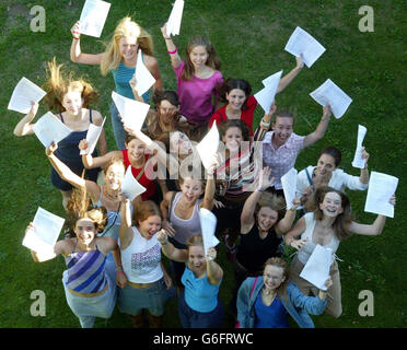 Eighteen students from Colchester County High School for Girls, Essex, jump for joy as they realise they've each achieved five passes at Grade A. Many young people were celebrating after getting the A-Level grades they needed to go to their first choice university. Stock Photo