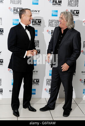 Tom Hanks and Paul Greengrass arriving at the 57th BFI London Film Festival Opening Night Gala European Premiere of Captain Phillips at The Odeon, Leicester Square, London. Stock Photo