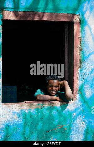 Portrait of an Ethiopian man in window. Near Alamata and Korem, Ethiopia Stock Photo