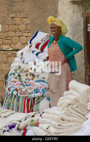 Fabrics vendor. Market day at Freweyni also known as Sinkata. Tigray, Misraqawi Zone,  Saesi Tsaedaemba District, Ethiopia Stock Photo