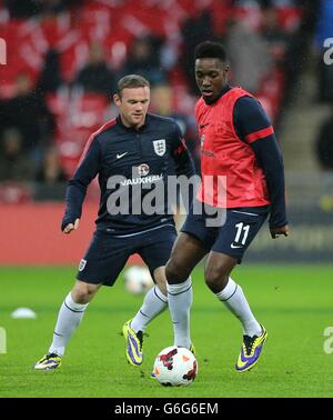 Soccer - FIFA World Cup Qualifying - Group H - England v Montenegro - Wembley Stadium. England's Wayne Rooney (left) and Danny Welbeck during the pre match warm up Stock Photo