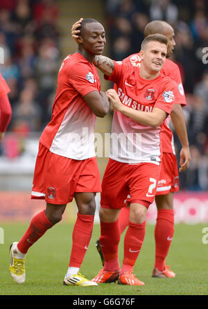Leyton Orient's Moses Odubajo (left) celebrates scoring his side's first goal with team mate Dean Cox during the Sky Bet League One match at the Matchroom Stadium, London. Stock Photo