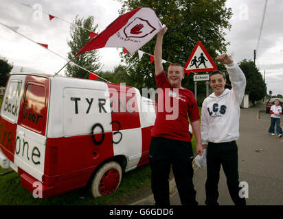 Gaelic Athletic Association fans Damien Crawford and Declan Gallagher, both 15, with a van painted in her county s colours in Strabane, Co Tyrone, ahead of the All-Ireland football final between Tyrone and defending champions Armagh. Tomorrow sees the biggest north-south exodus since the Pope s visit to Ireland nearly 25 years ago. Police on both sides of the border have made special arrangements to cope with an unprecedented volume of traffic between Northern Ireland and Dublin. Stock Photo