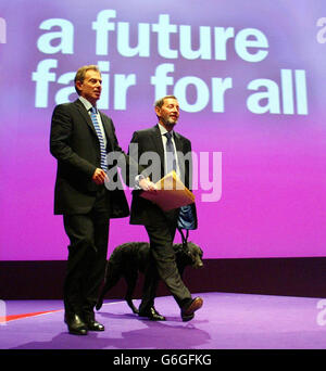 Prime Minister Tony Blair helps the Home Secretary David Blunkett to the podium, at the Labour Party Conference in Bournemouth. Blunkett signalled further action to curb gun crime if Labour gains a third term of office. * Mr Blunkett told Labour's conference: Two terms in office isn't enough to prepare Britain for the century ahead. In his keynote speech, he indicated the challenge of gun culture would be tackled head on if Labour won a third term in power. Stock Photo