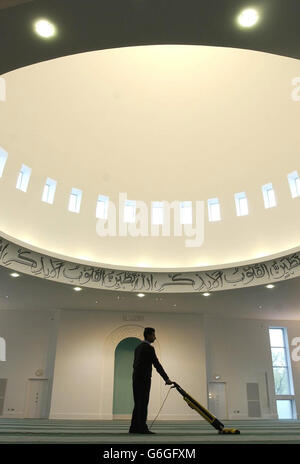 Final preparations are carried out in the main prayer room at the Baitul Futuh Mosque in Morden, south London, ahead of an inaugauration ceremony for the religious centre. * The mosque, the largest in Western Europe, can hold up to 10,000 worshippers and was built at a cost of 15 million by Britain's Ahmadi Muslims, who opened London's first mosque nearly 80 years ago. British devotees of the community will be joined by representatives from countries worldwide, including the worldwide supreme head of the community, Hadhrat Mirza Masroor Ahmad, at the ceremony. Stock Photo