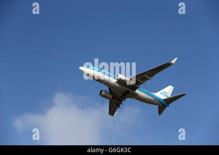 A KLM Royal Dutch Airlines Boeing 737-7K2(WL) plane takes off at Heathrow Airport Stock Photo