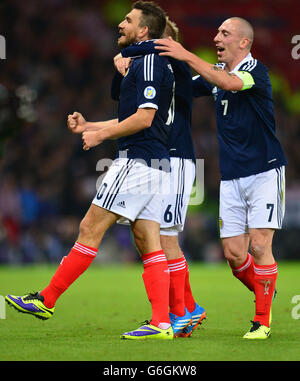 Scotland's Robert Snodgrass celebrates scoring with team mates during the FIFA 2014 World Cup Qualifying, Group A match at Hampden Park, Glasgow. Stock Photo