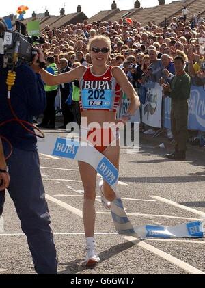 Paula Radcliffe after smashing the world half-marathon record, at the BUPA Great North Run, Newcastle. Taking the 13.1-mile race by the scruff of the neck when the starting pistol sounded, Radcliffe covered the distance in an amazing time of 65 minutes 40 seconds. The stunning performance was four seconds under the previous mark set by Susan Chepkemei two years ago. Stock Photo