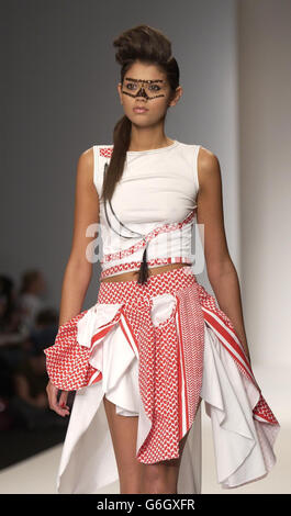 A model on the catwalk during the spring/summer 2004 show by designer Arkadius as part of London Fashion Week at the BFC Tent at the Duke of York's HQ in Chelsea, London. Stock Photo