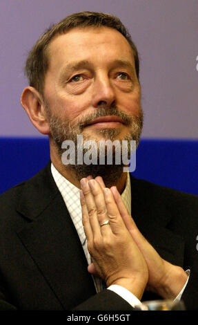 Home Secretary David Blunkett listens to speakers at a forum for chief constables at the Institute of Directors, central London. The 43 chief constables in England and Wales were told at the summit there will be new 'far-reaching' reforms of the way police operate. Mr Blunkett said he wanted forces to strike up better relationships with their communities and increase local accountability. Stock Photo