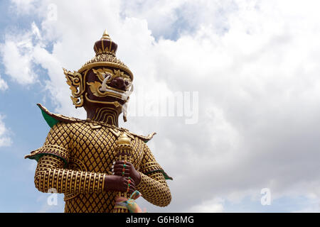 Giant Statue in Temple on sky background, Thailand. Art vintage style in Places of worship. Stock Photo