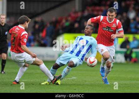 Coventry City's Franck Moussa (centre) is brought down during the Sky Bet League One match at the Banks' Stadium, Walsall. PRESS ASSOCIATION Photo. Picture date: Saturday October 26, 2013. See PA story SOCCER Walsall. Photo credit should read: Dave Howarth/PA Wire.