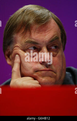 Deputy Prime Minister John Prescott listens to Gordon Brown, Chancellor of the Exchequer, deliver his speech to party delegates, on the second day of the annual Labour Party Conference in Bournemouth. Mr Brown today declared that the Government is steeled to take the top decisions needed to achieve social justice - warning that the Labour way will often involve taking 'the hard road'. In his keynote speech, he cautioned that only by being true to its values and objectives would the Government regain the public's trust following its recent troubles. Stock Photo