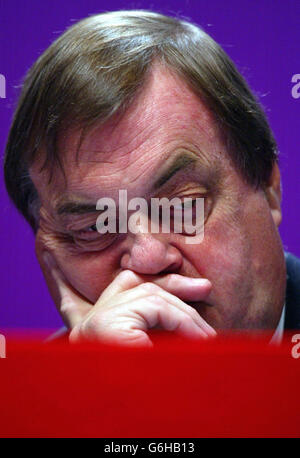 Deputy Prime Minister John Prescott listens to Gordon Brown, Chancellor of the Exchequer, delivering his speech to party delegates, on the second day of the annual Labour Party Conference in Bournemouth. Mr Brown today declared that the Government is steeled to take the top decisions needed to achieve social justice - warning that the Labour way will often involve taking 'the hard road'. In his keynote speech, he cautioned that only by being true to its values and objectives would the Government regain the public's trust following its recent troubles. Stock Photo